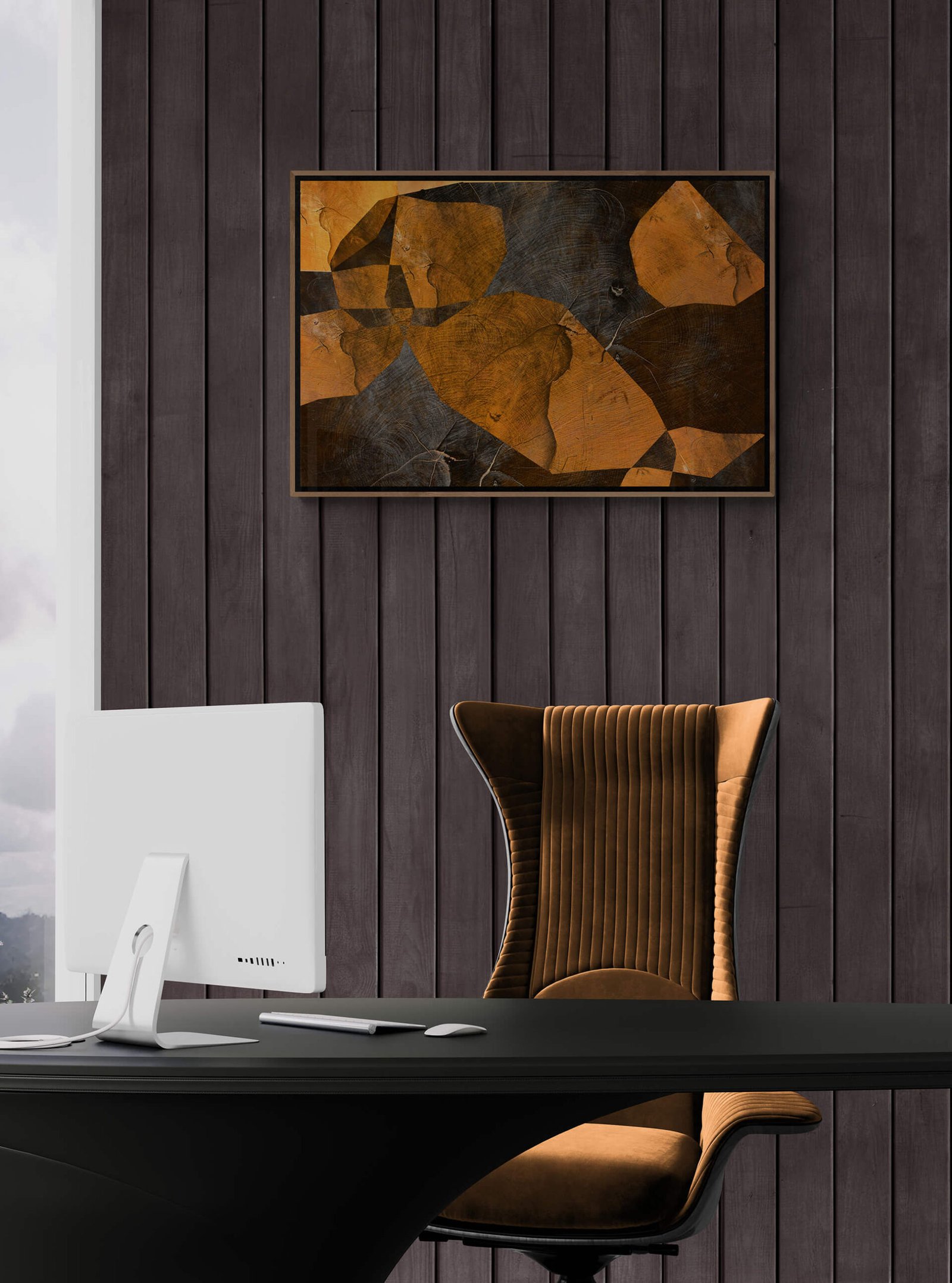 Cross section I by Ryszard filipowicz mockup, widok wiszącego wydruku w ramie na ścianie obok biurka i nowoczesnego fotela obitego jasnobrązowym, miodowym pluszem